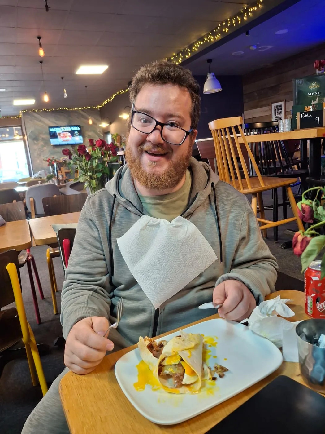 A customer enjoying a £6 full English breakfast at Revive Cafe Norwich