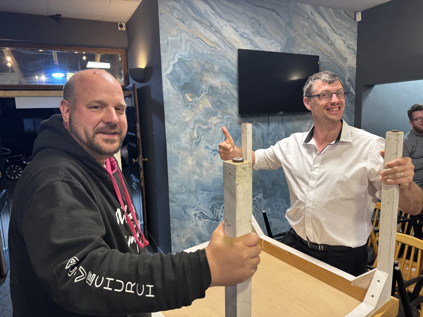 Volunteers building furniture while setting up Revive Cafe, Norwich